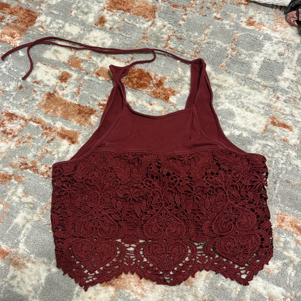 Tank top. Lacy flowers on the bottom.